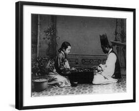 Korean Man and Woman Playing a Game Photograph - Korea-Lantern Press-Framed Art Print