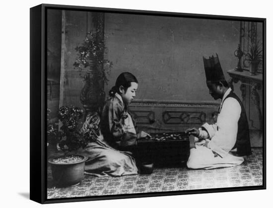 Korean Man and Woman Playing a Game Photograph - Korea-Lantern Press-Framed Stretched Canvas