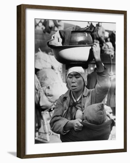 Korean Mother Nursing Her Baby, Carrying All Her Belongings in a Wash Basin, Retreating from Seoul-Carl Mydans-Framed Photographic Print