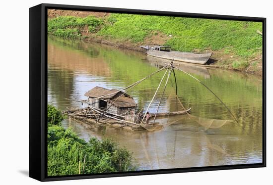 Kratie, Cambodia. Floating Vietnamese houseboat on the Mekong River in Kratie, Cambodia.-Yvette Cardozo-Framed Stretched Canvas