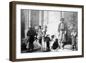 Kurdish Barber, Outside Kazimain Mosque, Iraq, 1917-1919-null-Framed Giclee Print