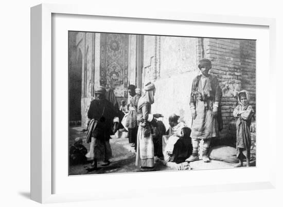 Kurdish Barber, Outside Kazimain Mosque, Iraq, 1917-1919-null-Framed Giclee Print