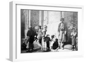 Kurdish Barber, Outside Kazimain Mosque, Iraq, 1917-1919-null-Framed Giclee Print