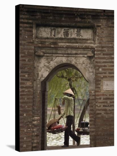 Lady Carrying Baskets, Hoan Kiem Lake, Hanoi, Northern Vietnam, Southeast Asia-Christian Kober-Stretched Canvas