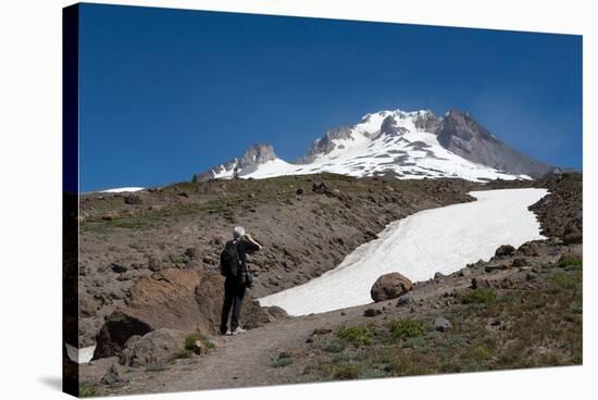 Lady hiker near a glacier on Mount Hood, part of the Cascade Range, Pacific Northwest region, Orego-Martin Child-Stretched Canvas