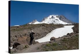 Lady hiker near a glacier on Mount Hood, part of the Cascade Range, Pacific Northwest region, Orego-Martin Child-Stretched Canvas