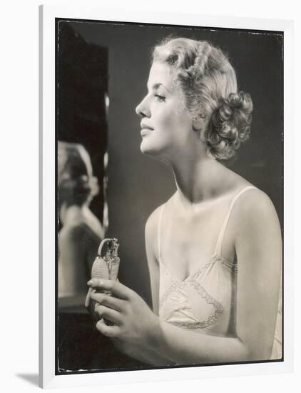 Lady in Her Slip Putting on Her Perfume Before Dressing-null-Framed Art Print