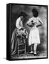 Lady Tries on a Corset While Another Woman Waits with Another One-null-Framed Stretched Canvas