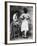 Lady Tries on a Corset While Another Woman Waits with Another One-null-Framed Photographic Print