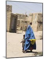 Lady Wearing Burqa Walks Past Houses Within the Ancient Walls of the Citadel, Ghazni, Afghanistan-Jane Sweeney-Mounted Photographic Print