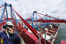 Engineer in Hard-Hat Overlooking Large Commercial Container Port and Ship-lagardie-Photographic Print