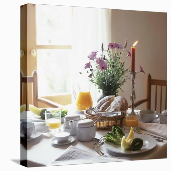 Laid Breakfast Table with Baked Goods, Juice and Fruit-null-Stretched Canvas