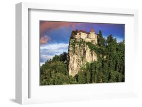 Lake Bled Castle rises on cliffs above Lake Bled, Slovenia at sunset-Miva Stock-Framed Photographic Print