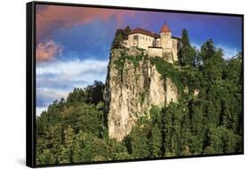 Lake Bled Castle rises on cliffs above Lake Bled, Slovenia at sunset-Miva Stock-Framed Stretched Canvas