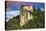 Lake Bled Castle rises on cliffs above Lake Bled, Slovenia at sunset-Miva Stock-Stretched Canvas