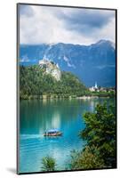 Lake Bled, Upper Carniola, Slovenia. Bled Castle seen across the lake. The town of Bled in the b...-null-Mounted Photographic Print