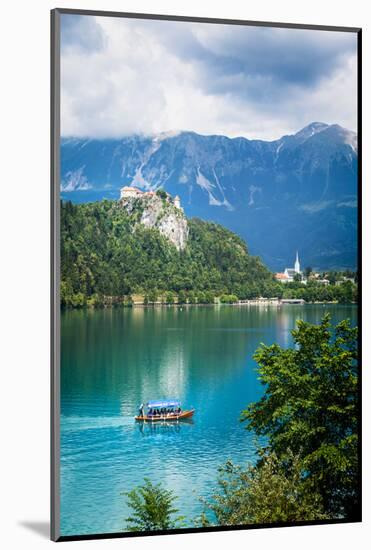 Lake Bled, Upper Carniola, Slovenia. Bled Castle seen across the lake. The town of Bled in the b...-null-Mounted Photographic Print