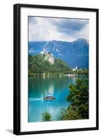 Lake Bled, Upper Carniola, Slovenia. Bled Castle seen across the lake. The town of Bled in the b...-null-Framed Photographic Print