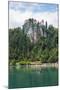 Lake Bled, Upper Carniola, Slovenia. Bled Castle seen across the lake. Tourists enjoying boating...-null-Mounted Photographic Print