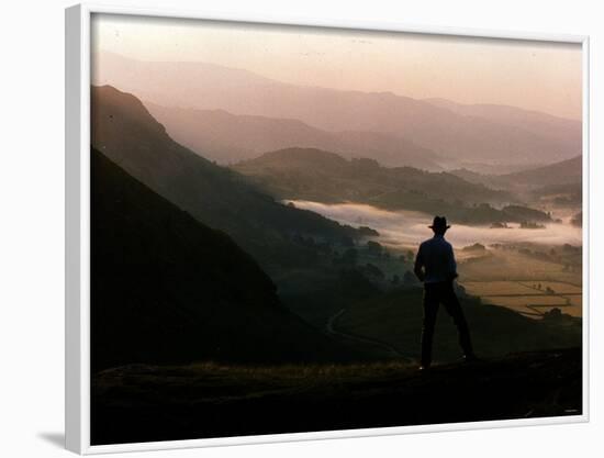 Lake District Dawn Rises in a Lakeland Pass Watched by Man in Hat-null-Framed Photographic Print