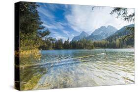 Lake Weissensee surrounded by woods with the Alps in the background, Biberwier, Carinthia, Tyrol, A-Roberto Moiola-Stretched Canvas