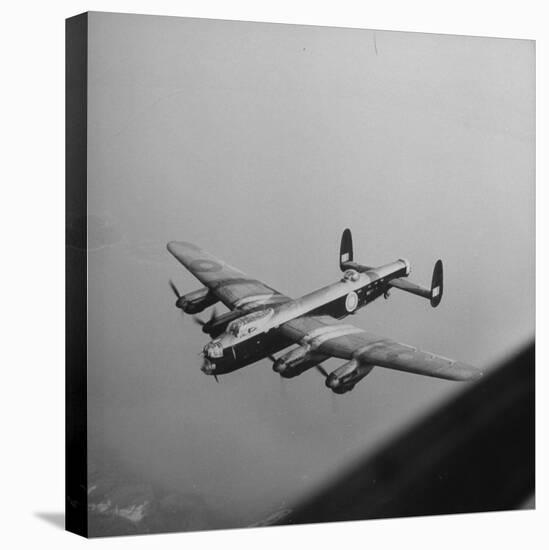 Lancaster Bomber in Flight-null-Stretched Canvas