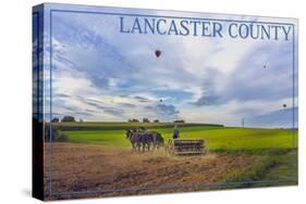 Lancaster County, Pennsylvania - Amish Farmer and Hot Air Balloons-Lantern Press-Stretched Canvas