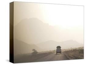 Land Cruiser Driving Along Dusty Road, Between Zagora and Tata, Morocco, North Africa, Africa-Jane Sweeney-Stretched Canvas