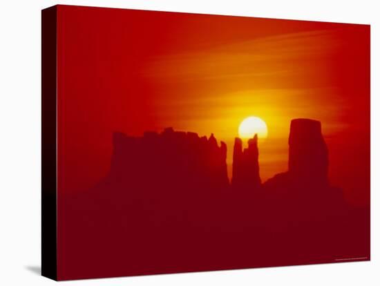 Land Formations and Red Sky, Navajo Reservation, Monument Valley Tribal Park, Arizona, USA-Jerry Ginsberg-Stretched Canvas