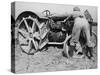 Land Girl Working with a Tractor on a Farm During World War I-Robert Hunt-Stretched Canvas