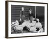 Land Girls Working Feeding Pigs on a Farm During World War II-Robert Hunt-Framed Photographic Print