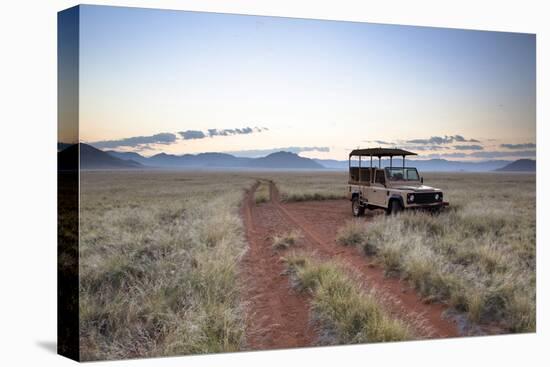 Land Rover Game Vehicle Parked by Sand Road at Sunrise-Lee Frost-Stretched Canvas