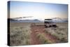 Land Rover Game Vehicle Parked by Sand Road at Sunrise-Lee Frost-Stretched Canvas