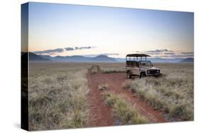 Land Rover Game Vehicle Parked by Sand Road at Sunrise-Lee Frost-Stretched Canvas