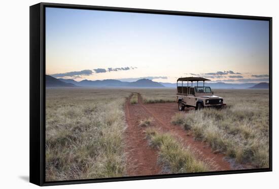 Land Rover Game Vehicle Parked by Sand Road at Sunrise-Lee Frost-Framed Stretched Canvas