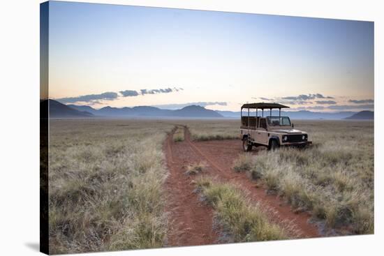 Land Rover Game Vehicle Parked by Sand Road at Sunrise-Lee Frost-Stretched Canvas