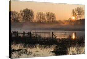 Landscape of Lake in Mist with Sun Glow at Sunrise-Veneratio-Stretched Canvas