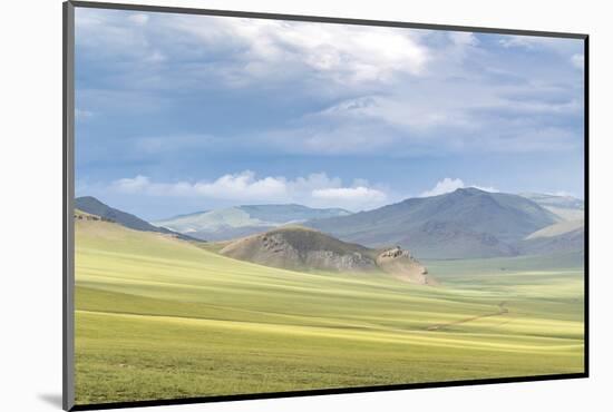 Landscape of the green Mongolian steppe under a gloomy sky, Ovorkhangai province, Mongolia, Central-Francesco Vaninetti-Mounted Photographic Print