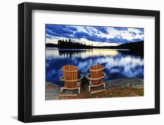 Landscape with Adirondack Chairs on Shore of Relaxing Lake at Sunset in Algonquin Park, Canada-elenathewise-Framed Photographic Print