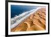 Langewand, Aerial view of where the Atlantic Ocean meets the sea of dunes in Western Namibia.-ClickAlps-Framed Photographic Print