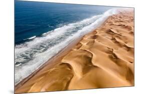 Langewand, Aerial view of where the Atlantic Ocean meets the sea of dunes in Western Namibia.-ClickAlps-Mounted Photographic Print