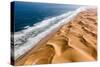 Langewand, Aerial view of where the Atlantic Ocean meets the sea of dunes in Western Namibia.-ClickAlps-Stretched Canvas