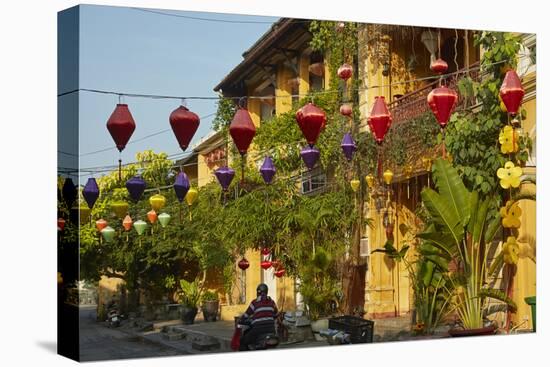 Lanterns and restaurants, Hoi An, Vietnam-David Wall-Stretched Canvas