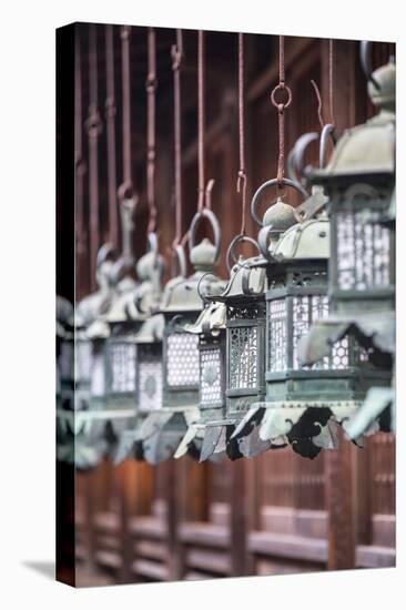 Lanterns at Kasuga Taisha Shrine (Unesco World Heritage Site) at Dusk, Nara, Kansai, Japan-Ian Trower-Stretched Canvas