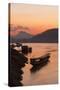 Laos, Luang Prabang, boats on Mekong River at sunset.-Merrill Images-Stretched Canvas