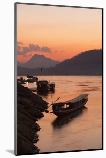 Laos, Luang Prabang, boats on Mekong River at sunset.-Merrill Images-Mounted Photographic Print