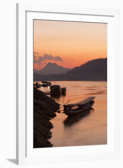 Laos, Luang Prabang, boats on Mekong River at sunset.-Merrill Images-Framed Photographic Print