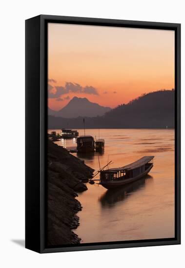 Laos, Luang Prabang, boats on Mekong River at sunset.-Merrill Images-Framed Stretched Canvas