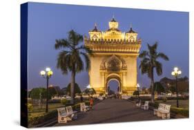 Laos, Vientiane. Patuxai, Victory Monument exterior at dusk.-Walter Bibikow-Stretched Canvas