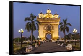 Laos, Vientiane. Patuxai, Victory Monument exterior at dusk.-Walter Bibikow-Framed Stretched Canvas